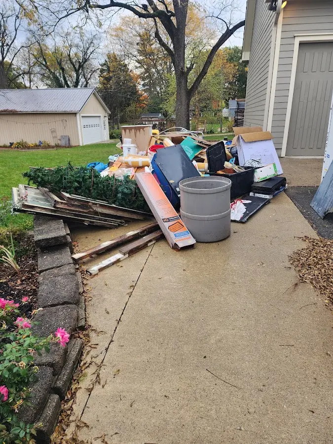 Dumpster being loaded with debris for Residential Dumpster Rental in Hammond